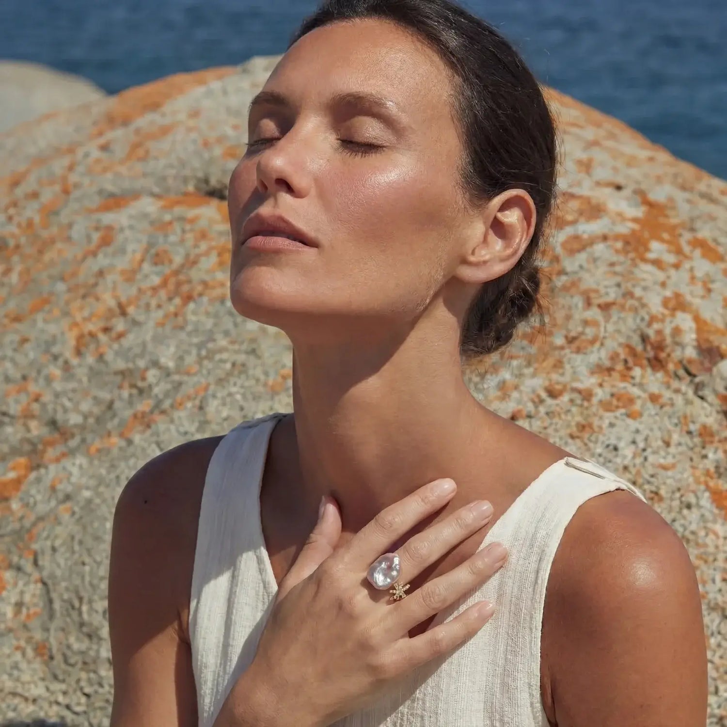 Woman showcasing Starlit Pearl Dreams Ring on hand - celestial freshwater pearl jewelry