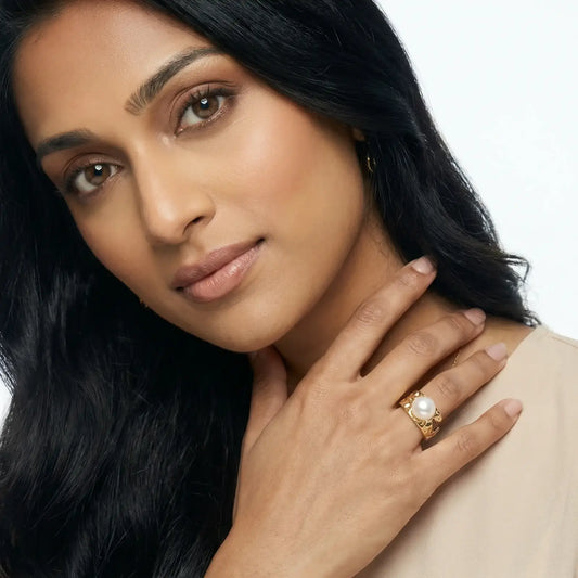 Golden Tide Pearl Ring | Freshwater Gold Ring – Glitter By Kate Wild worn on a woman's hand, showcasing its organic gold textures and pearl.